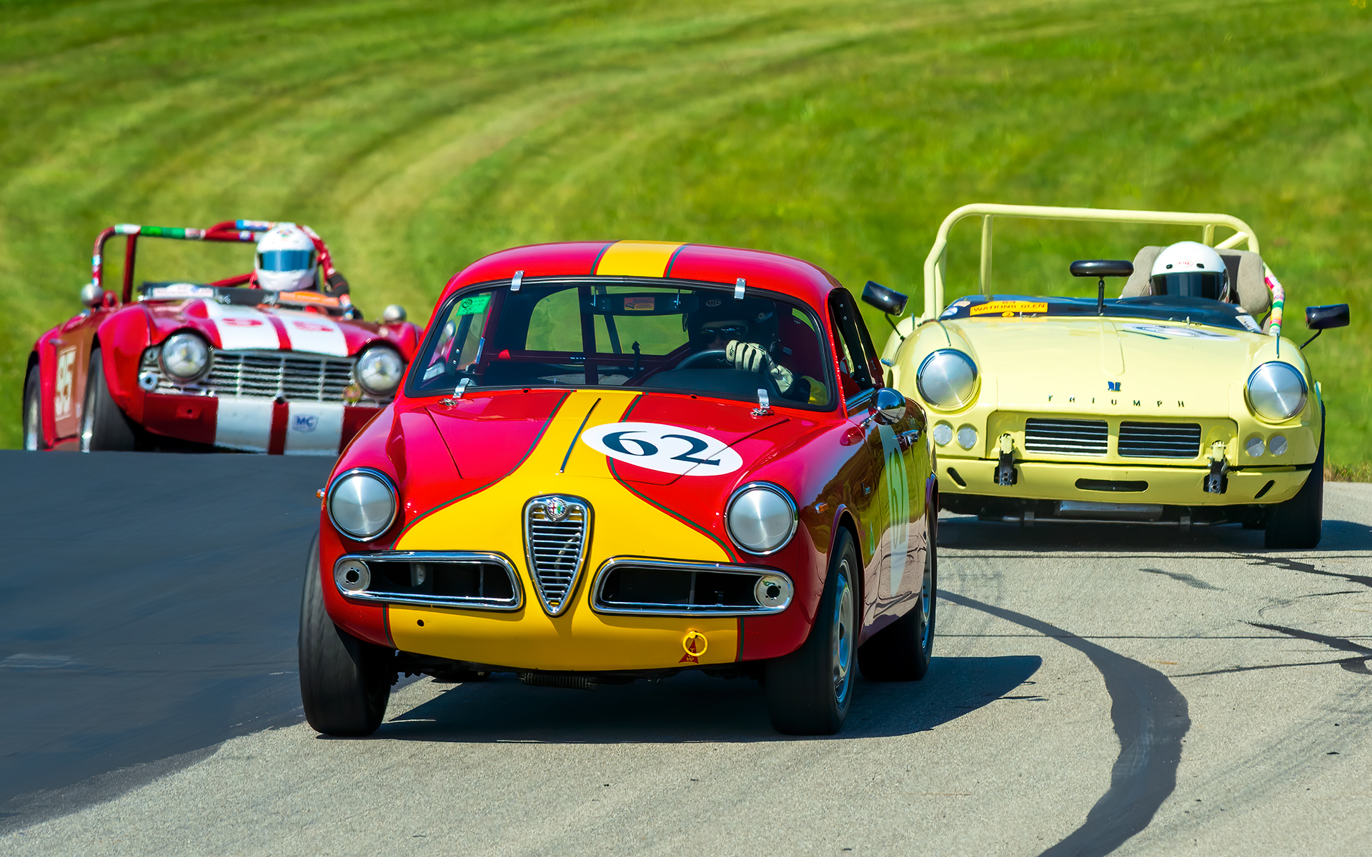 Alfa Romeo and two Triumphs road racing on hilly course. : Cars : Dan Sheehan Photographs - Fine Art Stock Photography