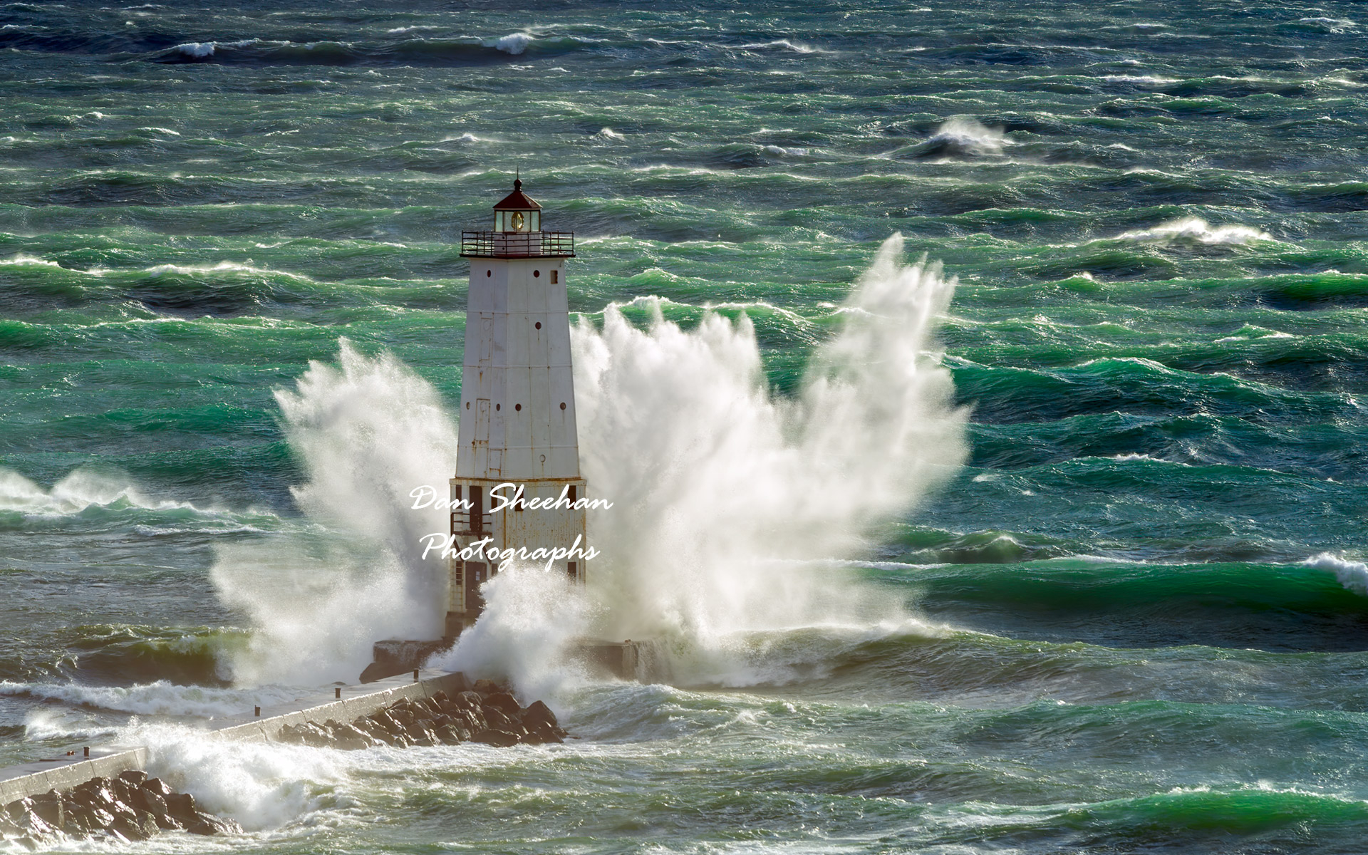 October, 2010 in Frankfort, Michigan. As this date confirms, this photographer has been capturing images of Great Lakes lighthouses during wind storms for quite some time. The storm depicted here was by a wide margin the strongest of all. So powerful and so long lasting was this storm the National Weather Service called it The Great Lakes Cyclone. Displayed here is late afternoon. My best images were captured the following morning when the storm had become even more powerful. I will add images from that dramatic morning in the near future. During the drive home I counted my blessings for both me and my equipment escaping unscathed.  : Lighthouses : Dan Sheehan Photographs - Fine Art Stock Photography