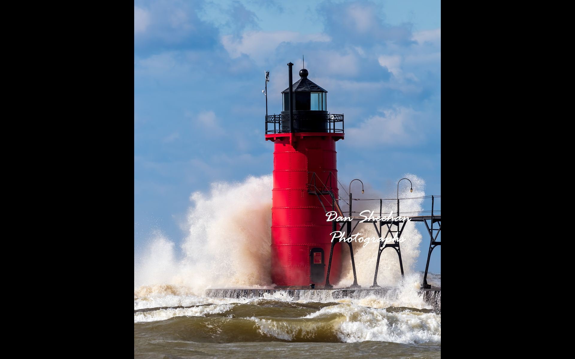 This beautiful lighthouse is located in picturesque South Haven, Michigan. I captured this image on a sunny but very windy day. A great sky and all natural color make this photograph really pop. : Lighthouses : Dan Sheehan Photographs - Fine Art Stock Photography